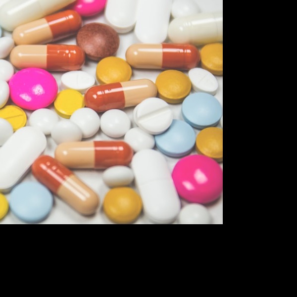 Generic medication tablets on white background